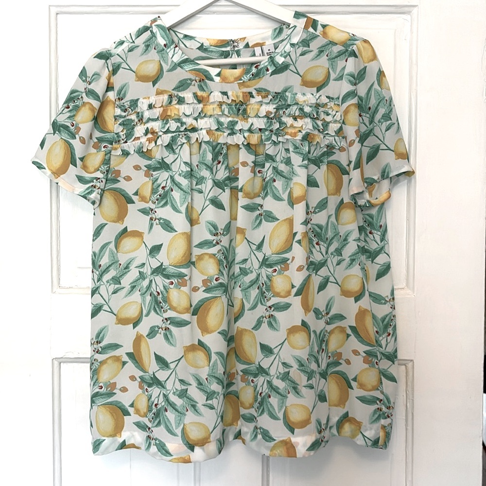 Lemon printed ruffle top. Size M. Never worn.